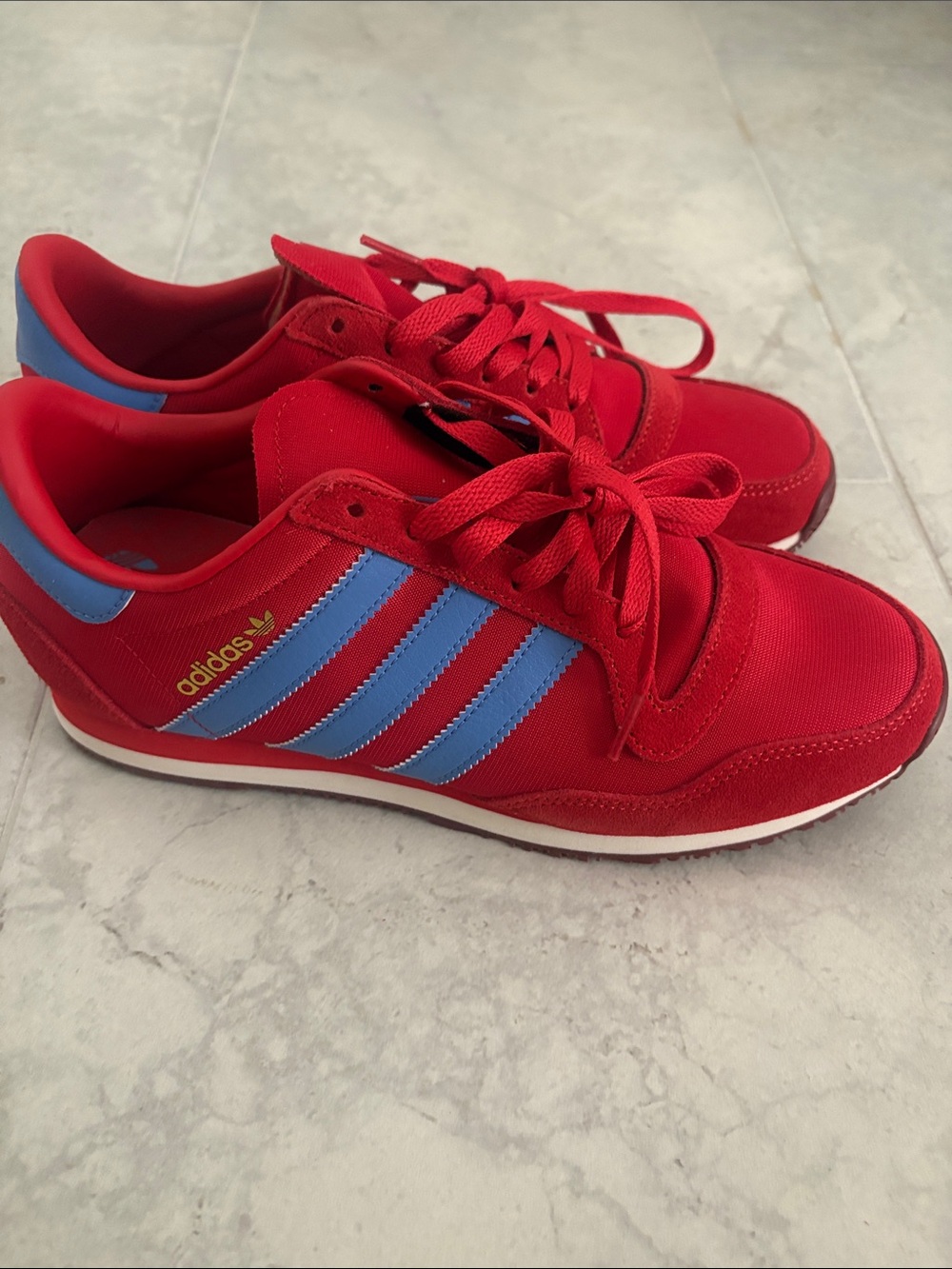 adidas Red Sneakers with Blue Stripes and Gold Logo